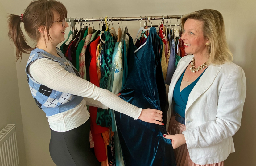 Kristy Adams and shopper looking through clothes